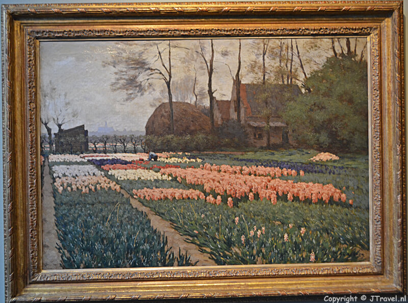 Het schilderij 'Hyacintenvelden bij Overveen met St. Bavo' van Anton L. Koster uit een particuliere collectie Museum De Zwarte Tulp in Lisse