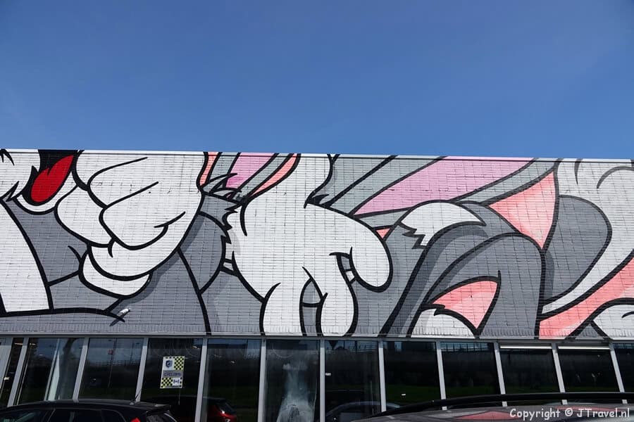 Street art van BustArt tijdens mijn street art wandeling in de Rotterdamse wijk Feijenoord