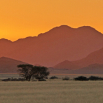 De zonsondergang tijdens de sundowner op de Little Sossus Campsite<br/>Copyright © JTravel.nl De zonsondergang tijdens de sundowner op de Little Sossus Campsite / Copyright © JTravel.nl