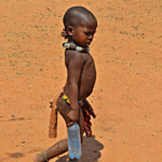 Een kind van de Himba stam in Otjikandero<br/>Copyright © JTravel.nl Een kind van de Himba stam in Otjikandero / Copyright © JTravel.nl
