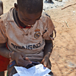 Een kind van de Himba stam in Otjikandero<br/>Copyright © JTravel.nl Een kind van de Himba stam in Otjikandero / Copyright © JTravel.nl