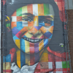 Muurschildering op de NDSM werf in Amsterdam Noord van Anne Frank<br/>Copyright © JTravel.nl Muurschildering op de NDSM werf in Amsterdam Noord van Anne Frank / Copyright © JTravel.nl