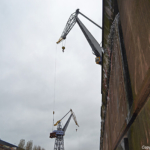 Water uit de muur in het dok van Damen Shiprepair in Amsterdam Noord tijdens de Instameet 24H Noord<br/>Copyright ยฉ JTravel.nl Water uit de muur in het dok van Damen Shiprepair in Amsterdam Noord tijdens de Instameet 24H Noord / Copyright ยฉ JTravel.nl